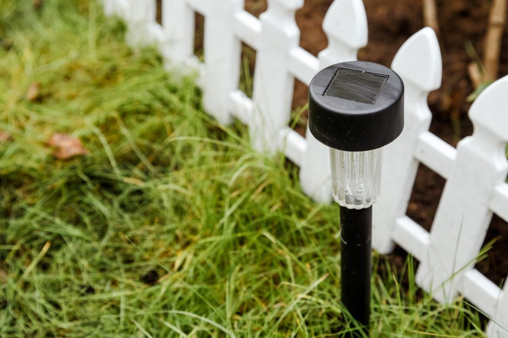 Solar-powered garden lamp in the daytime. Renewable eco energy in domestic life